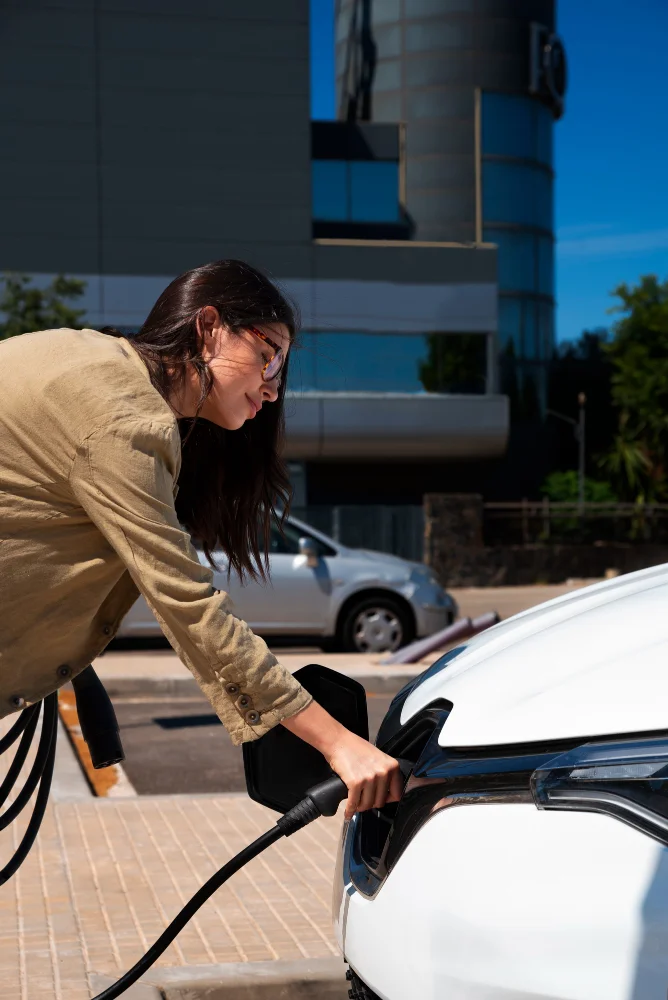 woman charging her car in public